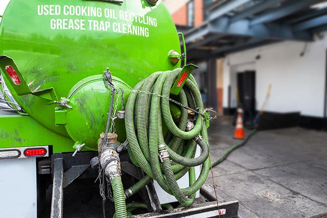 a professional service truck pumping a grease trap in Bedford Heights